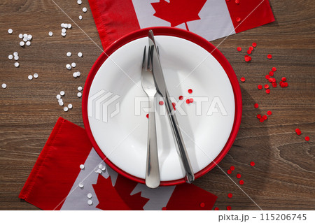 Cutlery with flag of Canada on wooden background 115206745