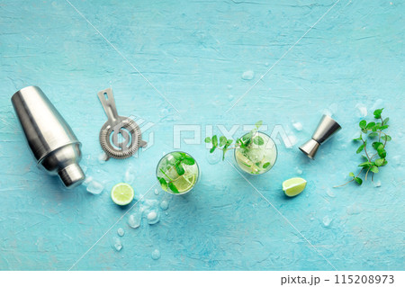 Mojito cocktail. Summer cold drink with lime, fresh mint, and ice. Cool beverage 115208973