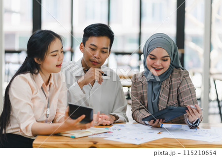 Businesswoman explaining colleagues during meeting in office. 115210654