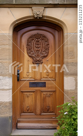 Vintage brown wooden front door on the facade of a house, AI generated 115211235