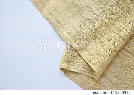 torn sackcloth isolated on white background, burlap fabric texture for design torn sackcloth isolated on white background, burlap fabric texture for design 115220982
