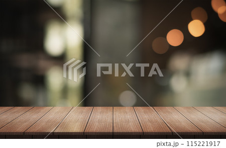 Empty wooden table top with lights bokeh on blur restaurant background. 115221917