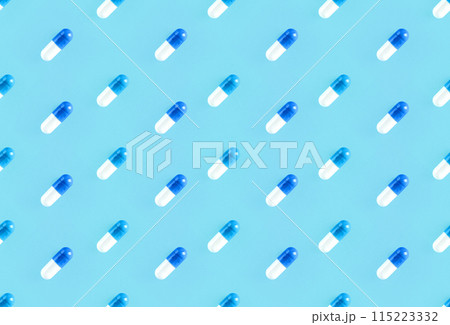 Seamless repetitive two-piece hard starch capsule pills on a soft blue background Seamless repetitive two-piece hard starch capsule pills on a soft blue background 115223332