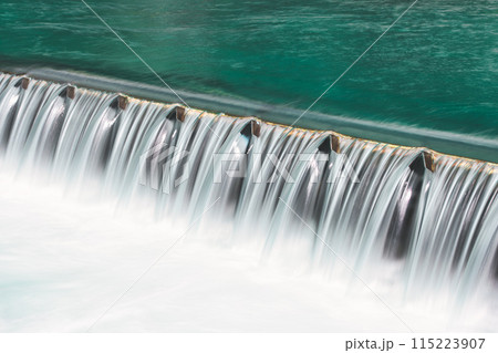 Foamy water in river dam 115223907