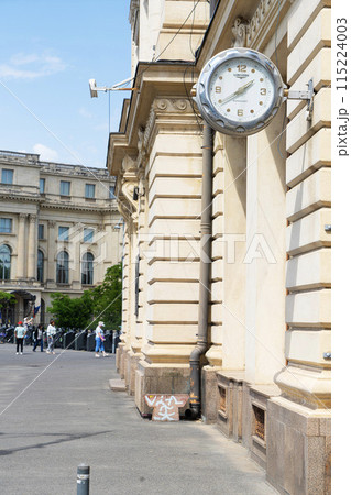 A clock on the wall in Bucharest, Romania A clock on the wall in Bucharest, Romania 115224003
