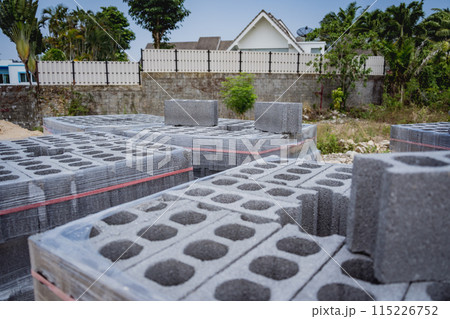 Concrete blocks with holes stacked on top of each other 115226752