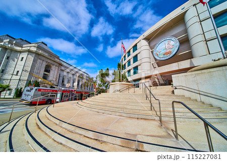 City transit bus beside steps leading to entrance of Public Utilities Commission building City transit bus beside steps leading to entrance of Public Utilities Commission building 115227081