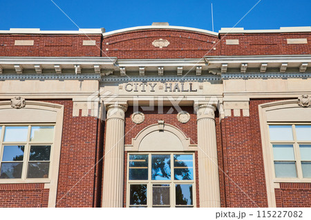 City hall sign on concrete portion of red brick building City hall sign on concrete portion of red brick building 115227082