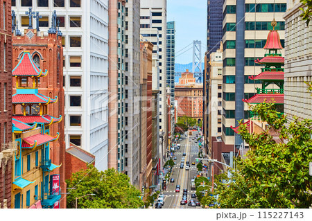 Chinatown buildings with colorful paint and steep road on hill leading to Oakland Bay Bridge 115227143