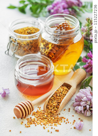 Raw organic bee pollen and honey in jars. Raw organic bee pollen and honey in jars. 115227236