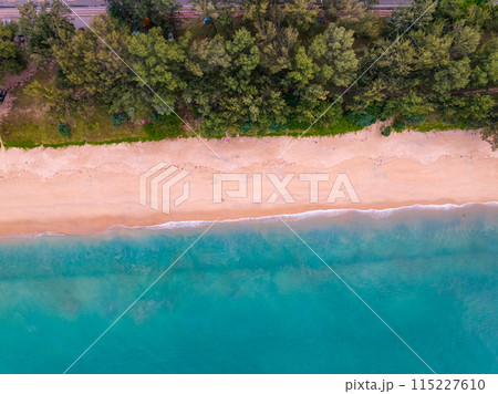 Bird eye view seashore with wave crashing on sandy shore. Beautiful waves sea surface in sunny day summer background, Amazing seascape top view seacoast landscape view 115227610