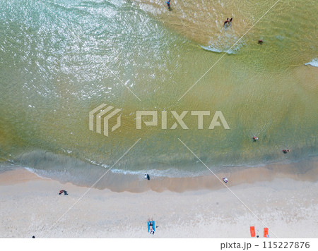 Aerial view of Waves crashing on sandy shore,Sea surface ocean waves background,Top view beach background 115227876