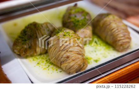 Uncooked madejas aragones on counter in cafe 115228262