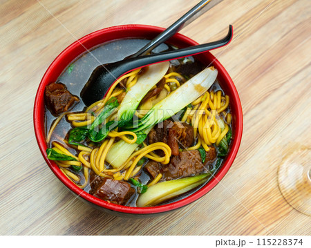 Beef soup with noodles 115228374