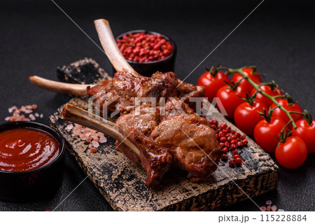 Delicious juicy meat on the bone or rack of lamb or grilled veal 115228884