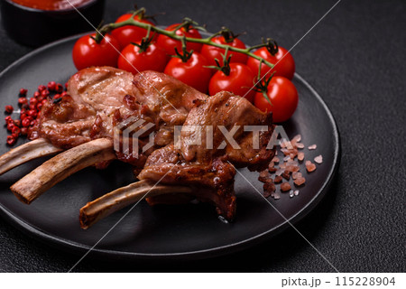 Delicious juicy meat on the bone or rack of lamb or grilled veal Delicious juicy meat on the bone or rack of lamb or grilled veal 115228904