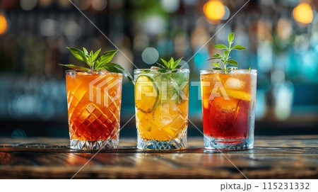 Three Colorful Cocktails on a Wooden Bar Counter 115231332