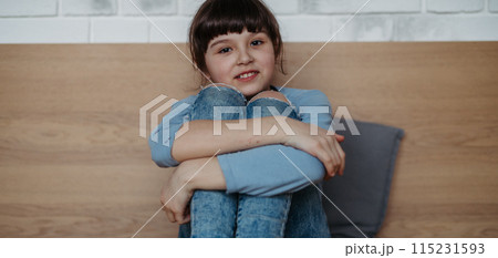 Portrait of cute young girl. Girl with long hair sitting at home. Banner with copy space. Portrait of cute young girl. Girl with long hair sitting at home. Banner with copy space. 115231593