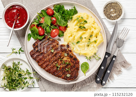 grilled pork steak with mashed potato and salad 115232120