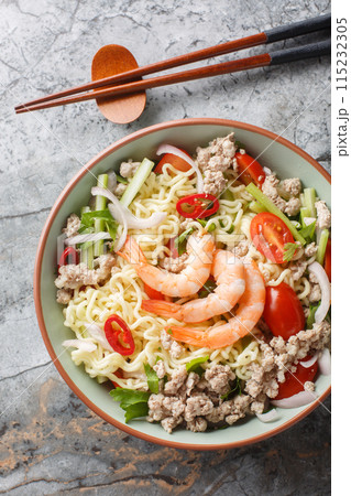 Yum Mama Thai Instant Noodle Salad closeup on the plate. Vertical top view 115232305