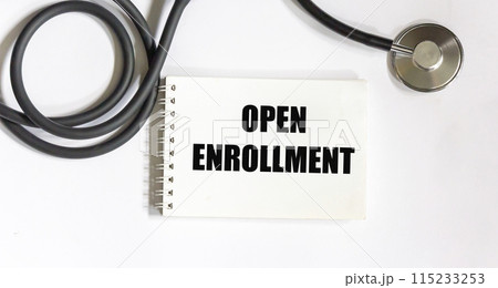 Stethoscope and notepad with text OPEN ENTRY on a white background. Medical concept. Stethoscope and notepad with text OPEN ENTRY on a white background. Medical concept. 115233253