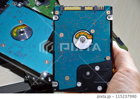 Hard disk drives are still widely used. hard drive in hand 115237990