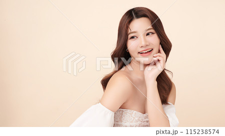 Beautiful young asian woman with clean fresh skin on beige background, Face care, Facial treatment, Cosmetology, beauty and spa, Asian women portrait. 115238574
