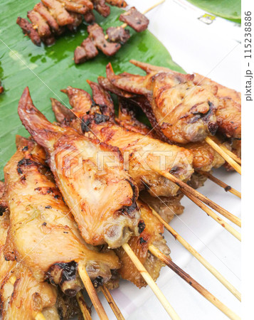 Thai street food, grilled chicken is very popular in Thailand. Thai street food, grilled chicken is very popular in Thailand. 115238886
