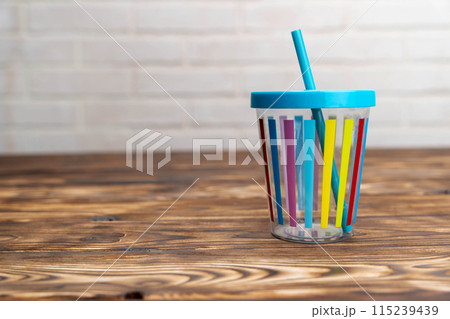 Cup With Straw on Table Cup With Straw on Table 115239439