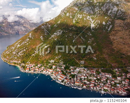 Aerial drone high view of Kotor bay, Boka Kotorska and coastal town Kotor, Cattaro, in Montenegro. Location place famous resort Montenegro. Adriatic fjord surrounded by rugged mountains 115240104