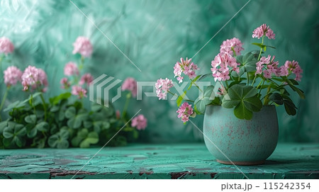 Green podium surrounded by pink clover flowers and clover leaves in a soft, natural setting. Generated AI. 115242354