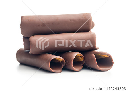Chocolate Covered Wafer Rolls Stacked On White Background Chocolate Covered Wafer Rolls Stacked On White Background 115243298