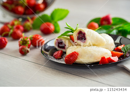cooked sweet homemade steamed dumplings with strawberries cooked sweet homemade steamed dumplings with strawberries 115243434