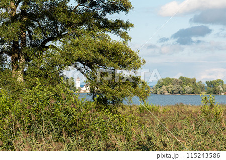 View from Herreninsel to the Monastery on Fraueninsel Island View from Herreninsel to the Monastery on Fraueninsel Island 115243586