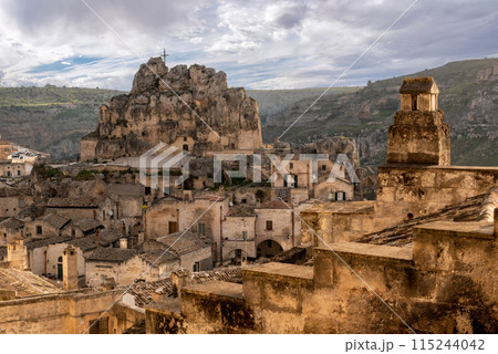 Scenic cityscape of Matera with the cave church Saint Mary of Idris, Southern Italy Scenic cityscape of Matera with the cave church Saint Mary of Idris, Southern Italy 115244042