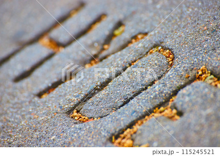 Diagonal HYDE name engraved into gray textured concrete 115245521