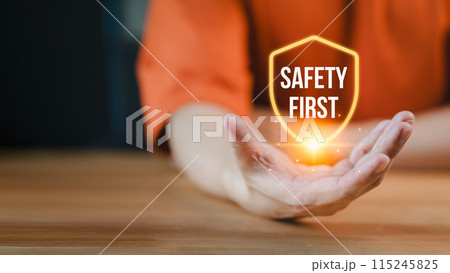 People presenting the safety banner symbol, highlighting a commitment to workplace safety, zero accidents, and fostering a culture of hazard awareness among workers. 115245825