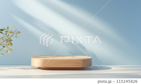 Beautiful round wooden podium, pedestal for an object against a background of a blue sunny wall.  115245826