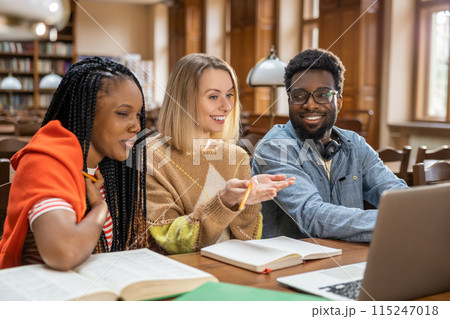 Group of young people working on the project together and looking involved 115247018