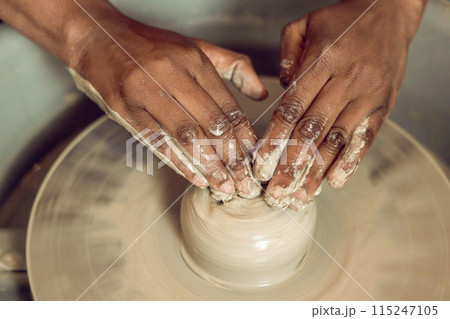 Close up of hands on a pottery wheel Close up of hands on a pottery wheel 115247105