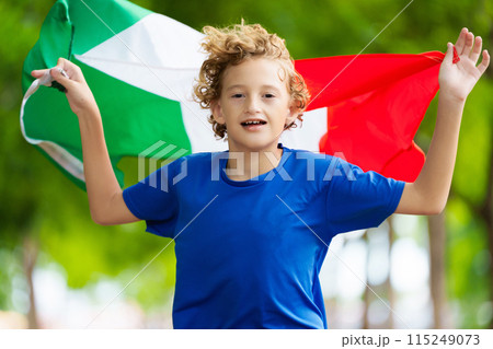 Child running with Italy flag. Italian fan. Child running with Italy flag. Italian fan. 115249073