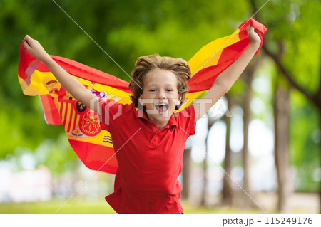Child running with Spain flag. Little Spanish fan. Child running with Spain flag. Little Spanish fan. 115249176