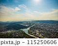 和歌山県紀の川市の百合山上空から水の入った田園の景色と街並みを空撮。6月 115250606