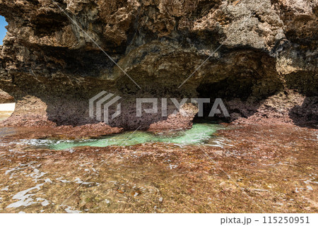 Natural sea rock pool below the cliff formed by a reef. Iriomote Island, Okinawa. 115250951