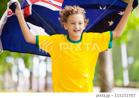 Australia football fan. Australian boy with flag. 115251707