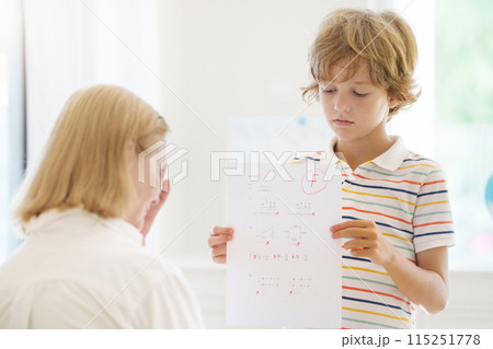 Kids fail math test in school. Child after exam. 115251778