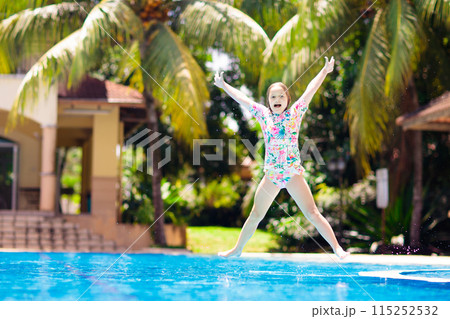 Child in swimming pool. Summer vacation with kids. 115252532