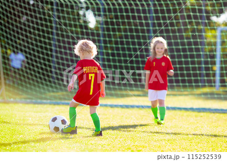 Portugal football fan kids. Children play soccer. 115252539