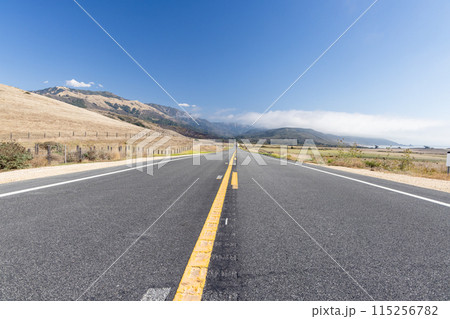 Asphalt road and countryside landscape 115256782