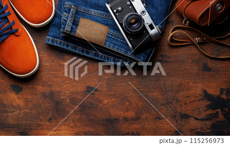 Men's Clothing on wooden Background 115256973